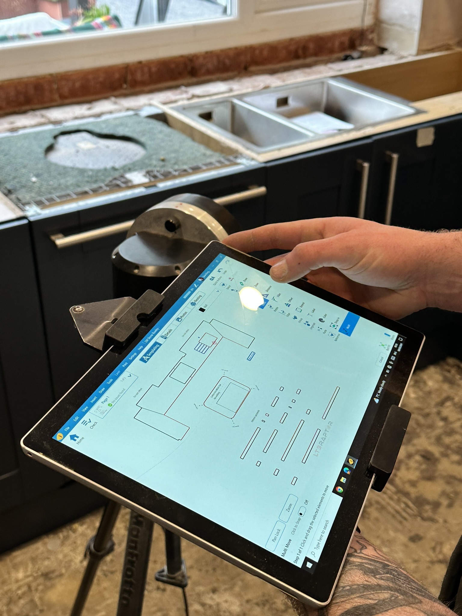 Graphics tablet showing how stone worksurfaces are measured and designed on site.