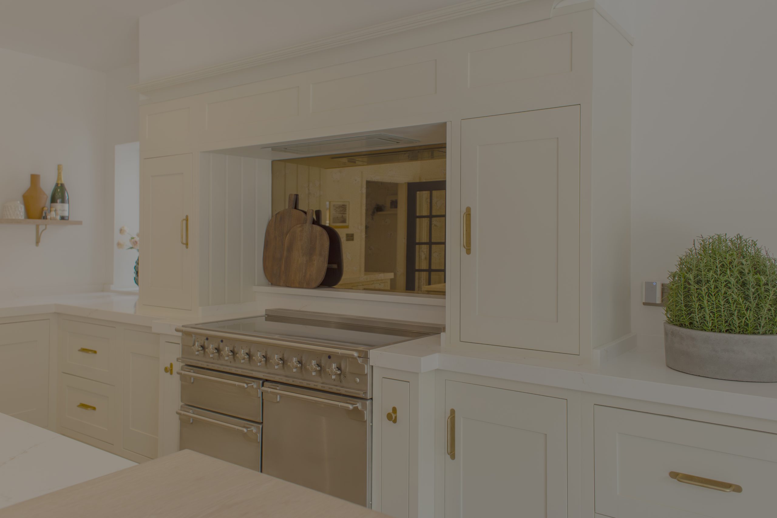 Royal peacock marble worktop with breakfast bar seating.