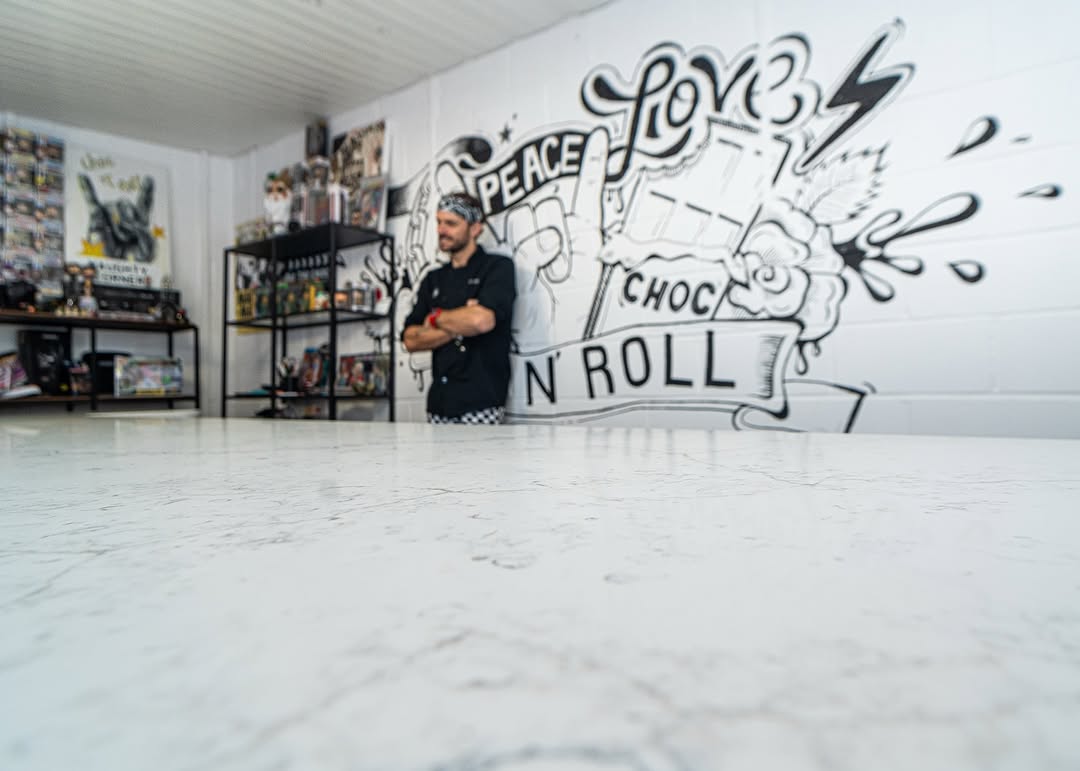 Royal peacock marble worktop with breakfast bar seating.